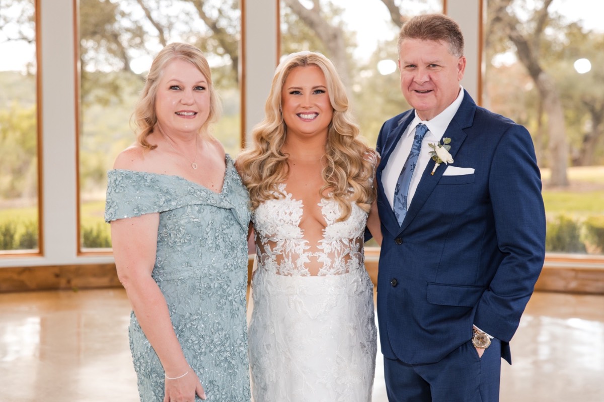 Bride dancing with father at Canyonwood Ridge winter wedding reception