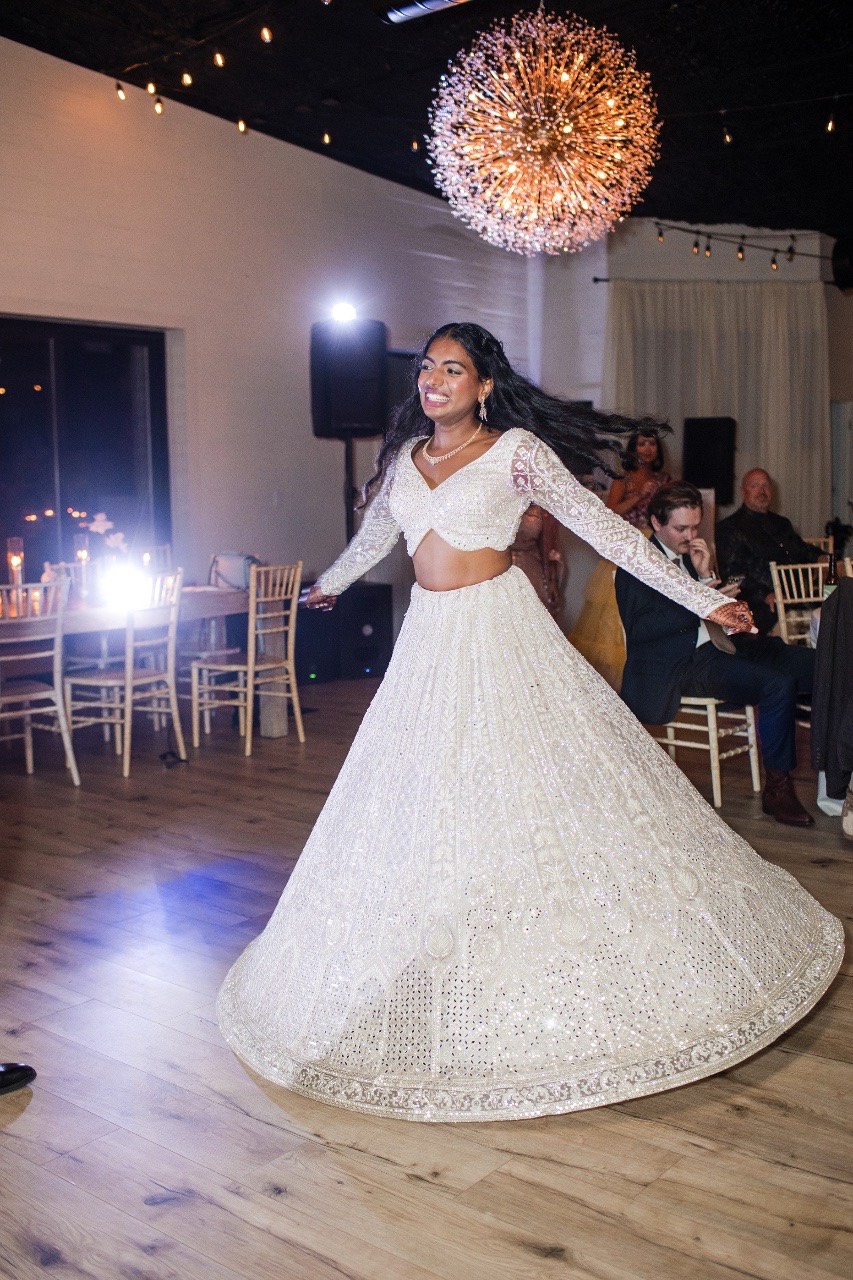 Bride dancing with guests at Two Hearts One Stream wedding reception