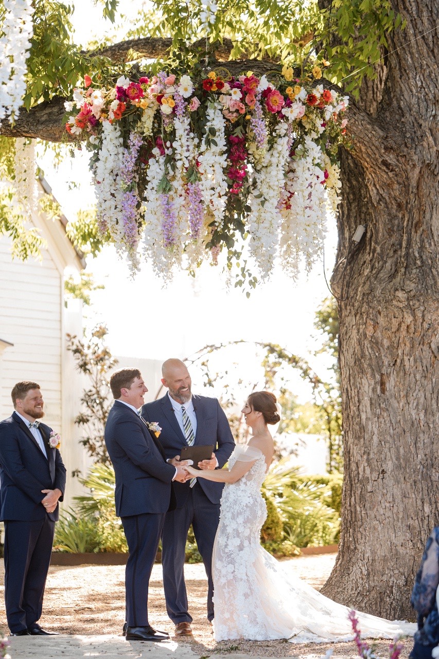Groom S and bride L standing together at Barr Mansion Austin