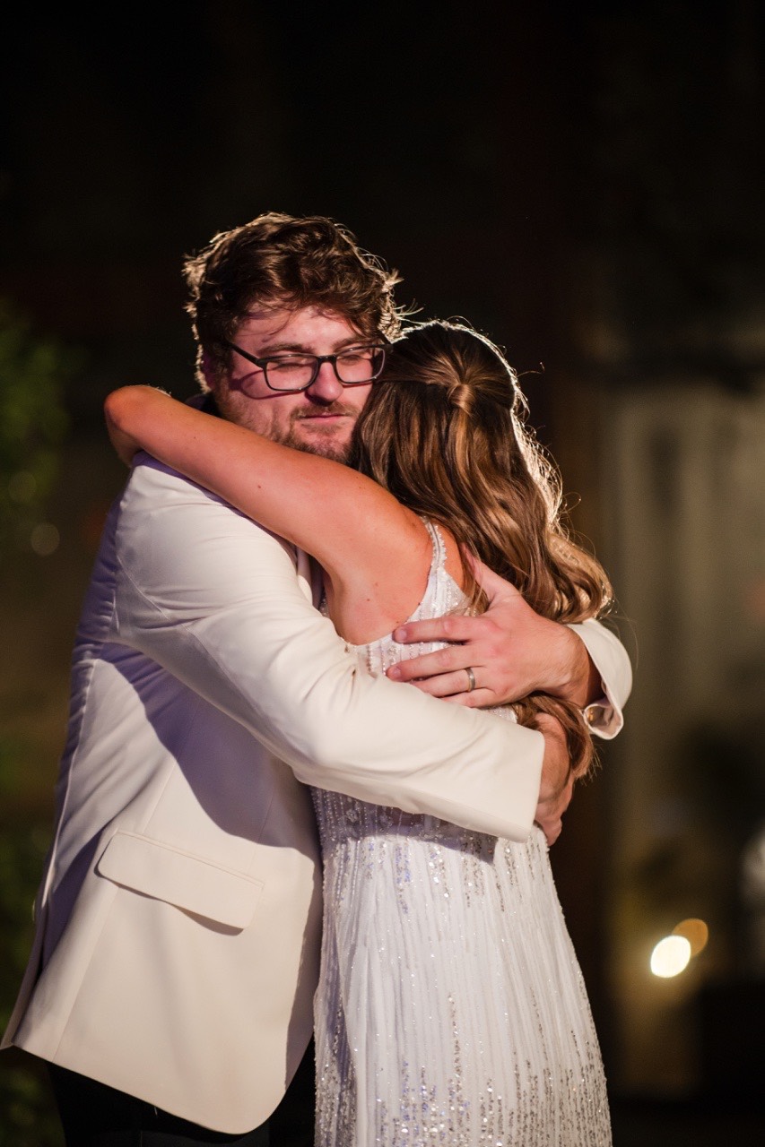 Groom's reaction during wedding toasts at Barr Mansion winter wedding Austin.