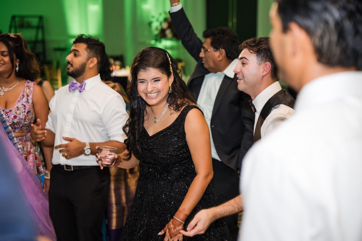 Bride and groom exiting Renaissance Austin Hotel as newlyweds captured by videographer