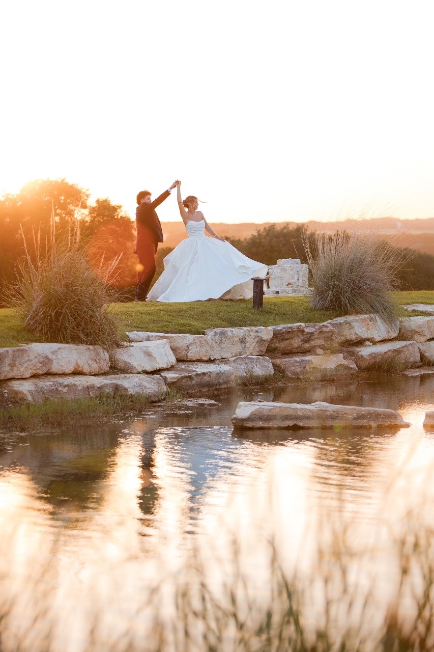 String lights illuminating Hidden River Ranch during evening reception