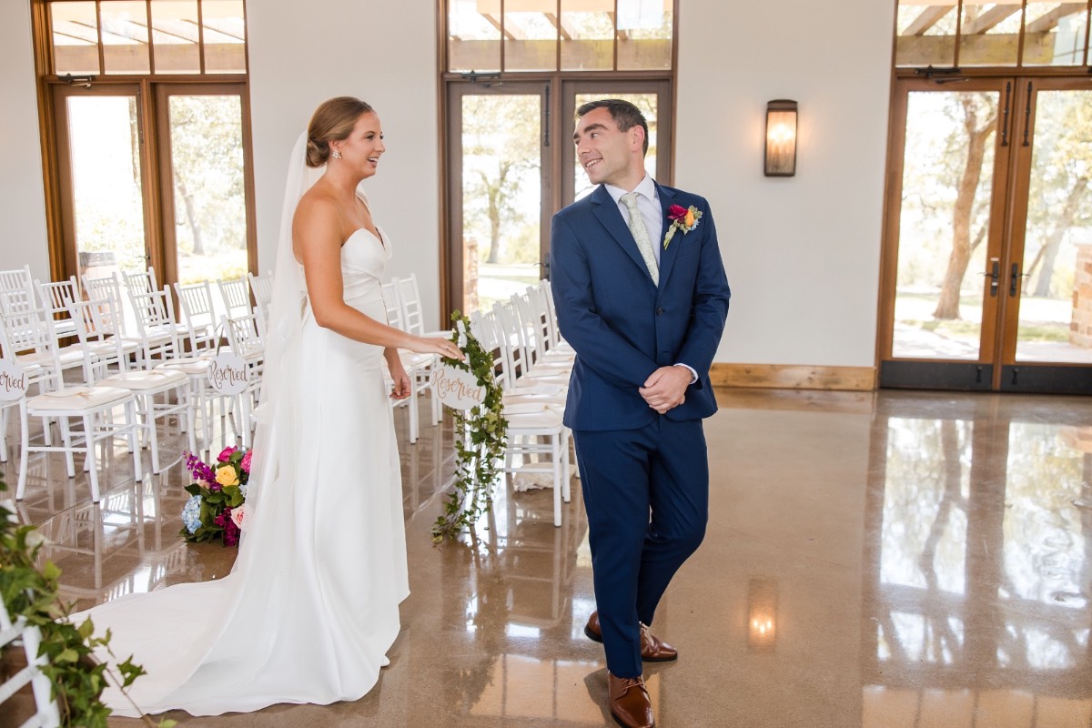 Groom M sharing a moment with his groomsmen before the Hill Country ceremony