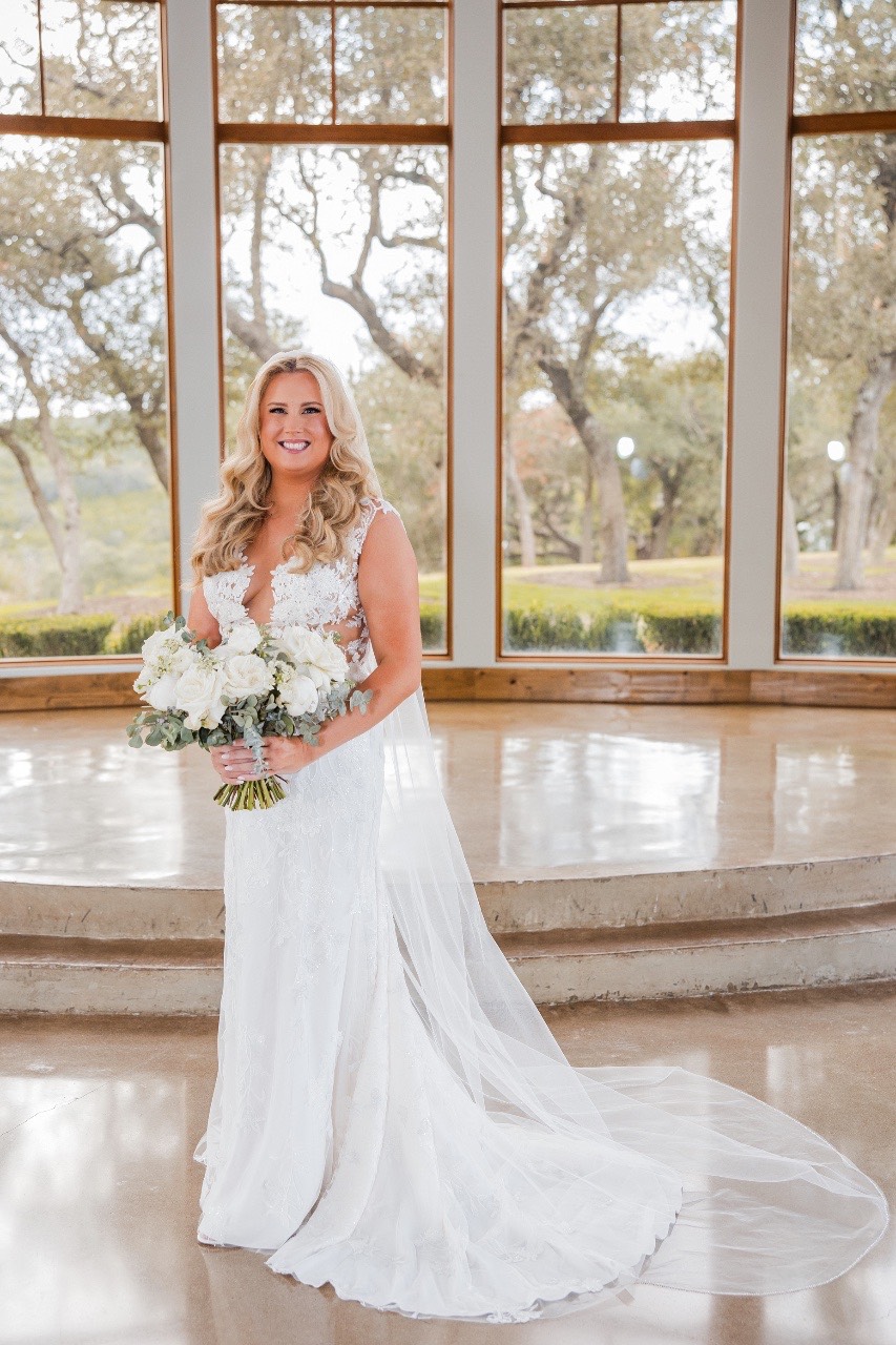Hair and makeup artist finalizing bride's look for Canyonwood Ridge ceremony