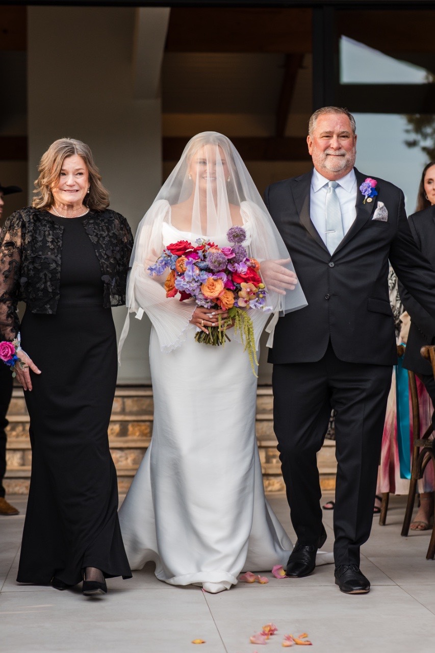 Couple reaction during emotional wedding toasts at Texas venue celebration