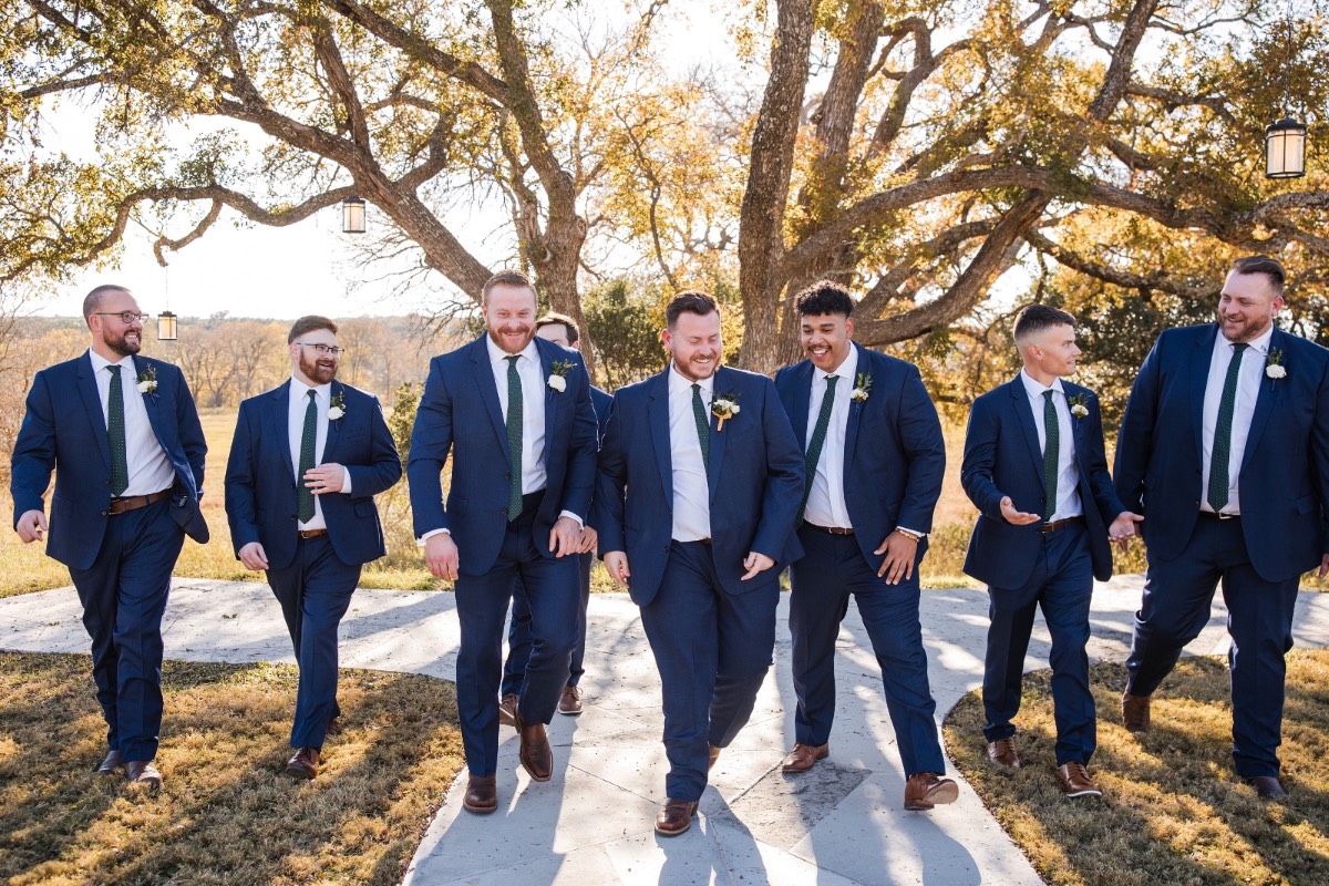 Just married couple exits ceremony at picturesque Highpointe Estate Liberty Hill location.