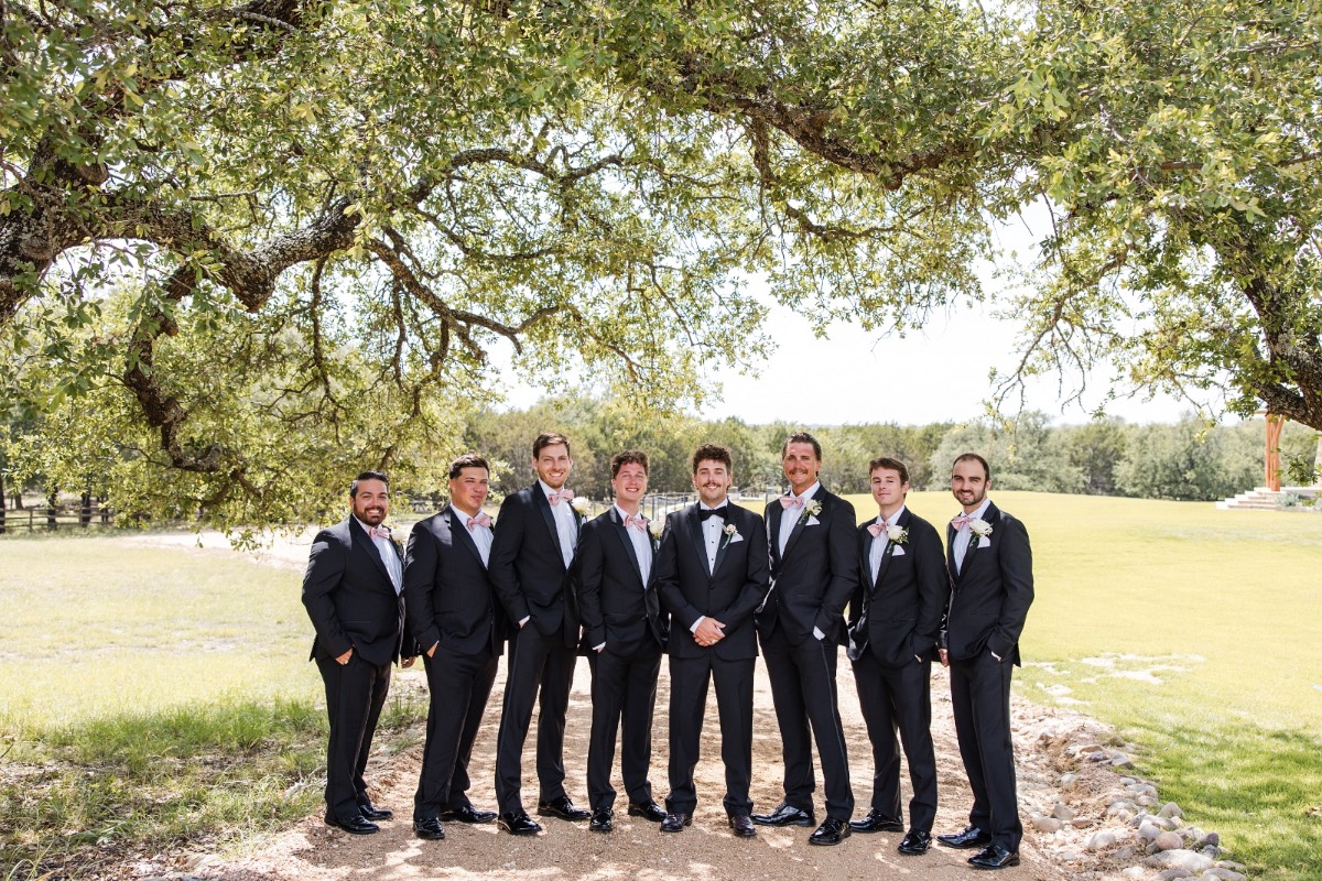 Bride walking toward groom for first look at Lampasas ranch venue