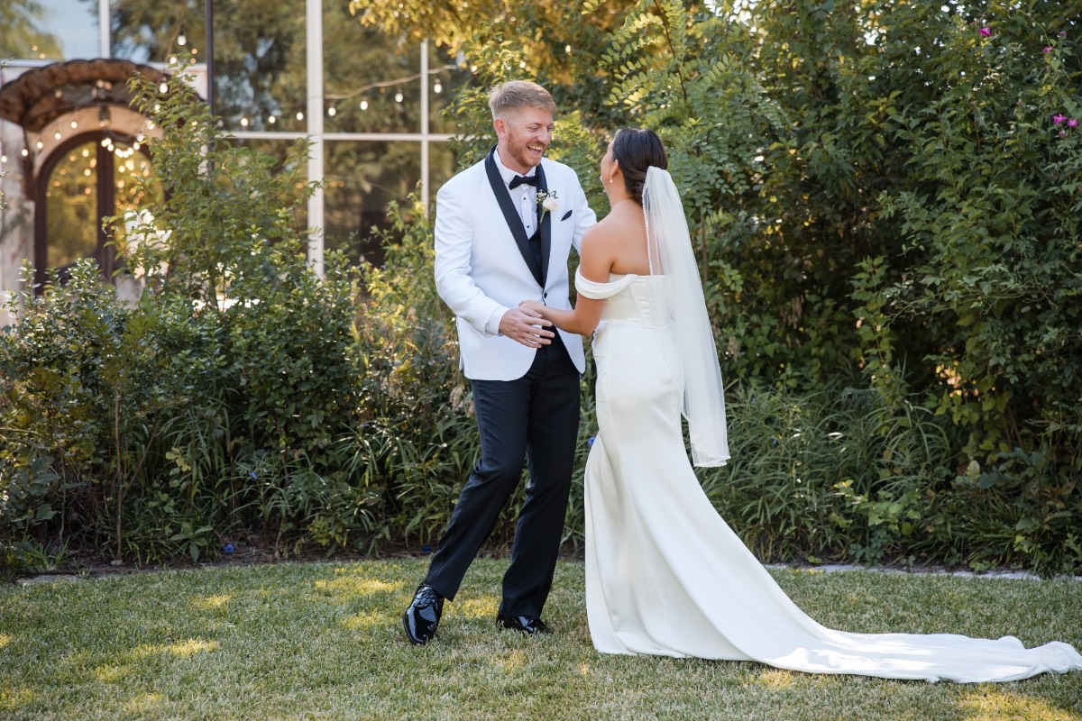 M's father helping adjust tie before ceremony at fall Barr Mansion wedding